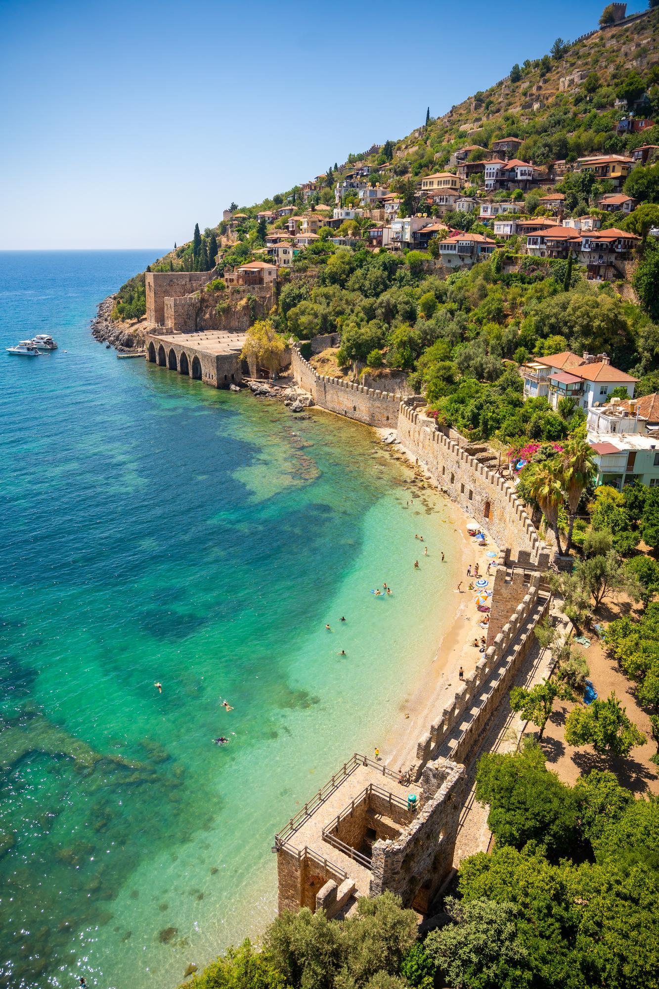 ancient-shipyard-tersane-near-kizil-kule-tower-beautiful-beach-calm-turquoise-sea